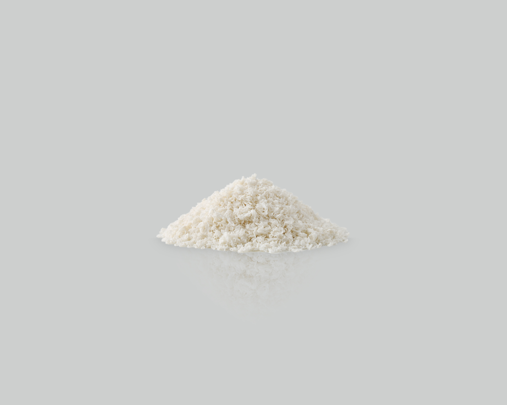 Granulado branco The Graft em detalhe sobre fundo neutro